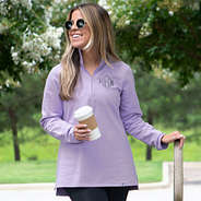 lavender pullover worn with leggings in the fall