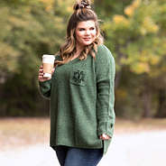 olive monogrammed boyfriend sweater on girl holding coffee