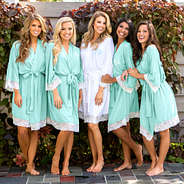 bridal party in monogrammed mint and white lace robes