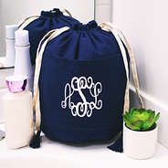 monogrammed navy blue ditty bag on bathroom counter