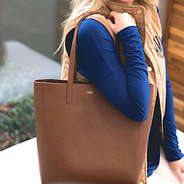 Model wearing dark brown leather simple deep tote