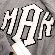 close up of sherpa letters on letterman sweatshirt