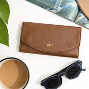 brown leather wallet flatlay 2025