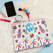 white cabana clutch on fur with makeup