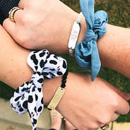 monogrammed beaded bracelets on girls' wrists with cute scrunchies