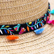 black headband with colorful mexicali design and multicolor tassels