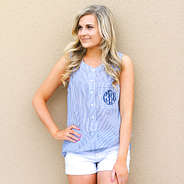 girl resting against wall wearing personalized seersucker tunic