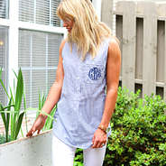 girl in garden wearing custom monogram initials on seersucker shirt