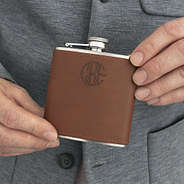 man holding personalized leather wrapped flask