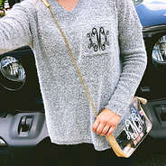 monogrammed clear crossbody on shoulder in front of jeep