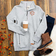 flat lay of gray monogrammed quilted pullover sweatshirt