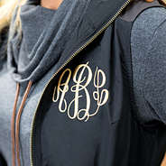 close up of monogrammed utility vest