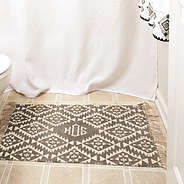 personalized grey mat in front of shower