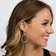 model wearing silver pave dangle earrings