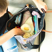 diaper bag with pockets on sides and monogram on front