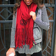 red monogrammed super soft fringe scarf with monogrammed herringbone vest and ruffle hem peplum tunic