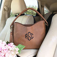 camel brown cheyenne purse in car