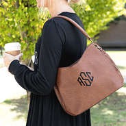 camel brown cheyenne purse on shoulder
