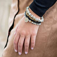 monogrammed bracelet stack with suede skirt