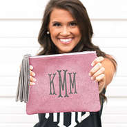 brunette holding rose gold glitter clutch