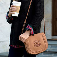 monogrammed crossbody with black sweater and coffee