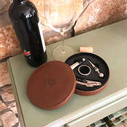 leather wine tool kit open on shelf