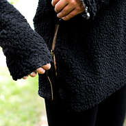 gold side zipper on black herpa turtleneck tunic