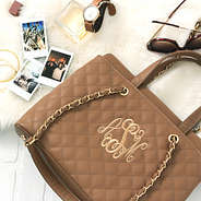 quilted chain handbag on fur rug