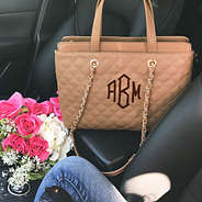 Monogrammed Quilted Handbag with Chain in Car with Flowers