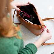 inside of brown crossbody bag with pockets