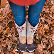 tall monogrammed duck boots in leaves