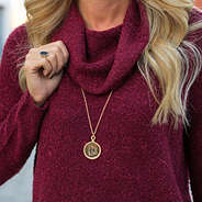 monogrammed gold rope pendant necklace on neck