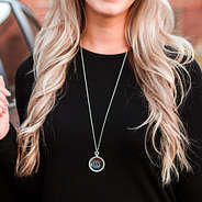 monogrammed silver rope pendant necklace on neck