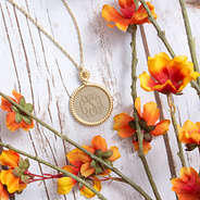 gold rope pendant necklace with orange flowers