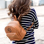monogrammed mini faux leather backpack with striped sweater