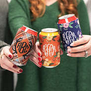 3 girls holding cans of drinks with monogrammed koolies