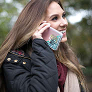 mint glitter monogrammed phone case held up to ear
