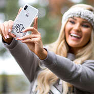 taking selfie with silver glitter phone case