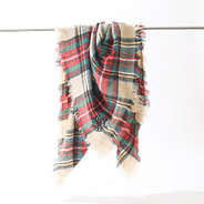 monogrammed camel plaid scarf on rack