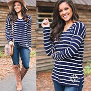 monogrammed striped v-neck sweater with jeans and riding boots