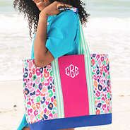 multi leopard monogrammed mega beach bag on girl's shoulder (NEW)