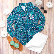 printed pullover with white shorts and embroidered sandals