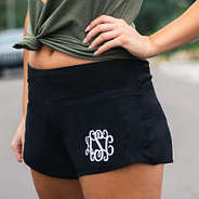 close up of monogrammed wide waistband running shorts