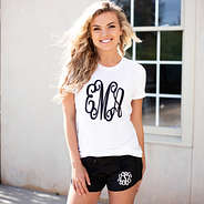 white monogrammed tee with black monogrammed athleisure shorts