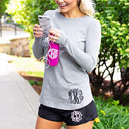black running shorts with gray long sleeve shirt and phone