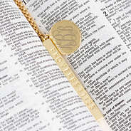 close up gold bible verse proverbs 31 necklace