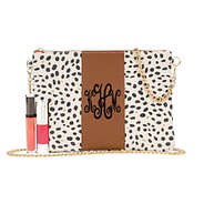 monogrammed leopard print clutch crossbody with makeup