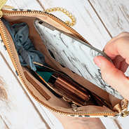 inside of monogrammed leopard clutch with zipper pocket