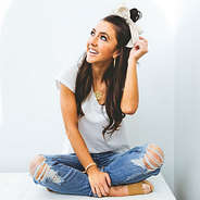 bow ribbon scrunchie tan seerscuker on top of head