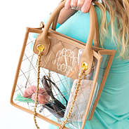 girl holding monogrammed clear tote with braided chains